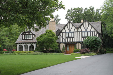 Inspiration for a timeless white two-story mixed siding exterior home remodel in Chicago with a shingle roof