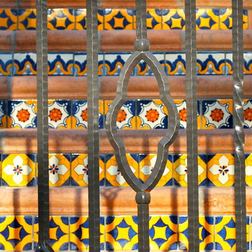wrot iron railing and decorative tile risers
