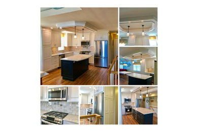 Example of a beach style kitchen design in Other with shaker cabinets, quartz countertops, subway tile backsplash, stainless steel appliances and an island