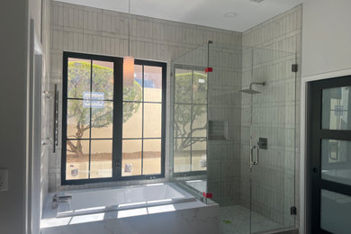 Mid-sized minimalist master white tile and porcelain tile ceramic tile, gray floor, single-sink and wallpaper bathroom photo in Phoenix with flat-panel cabinets, medium tone wood cabinets, gray walls, a pedestal sink, quartz countertops, white countertops and a floating vanity