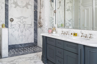 Traditional master bathroom in Florence with marble floors, an undermount sink, an open shower, white benchtops, recessed-panel cabinets, blue cabinets, an open shower, blue tile, white tile, marble, white floor and marble benchtops.