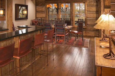 Example of a mountain style home design design in Denver