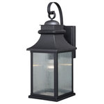 Vaxcel - Cambridge 9.25" Outdoor Wall Light Oil Rubbed Bronze - The Cambridge collection is the perfect blend of traditional and upscale class. Its updated lantern lines are highlighted in oil rubbed bronze and wrinkle glass panes. Ideal for your porch, entryway, garage, or any other area of your home. Dusk to dawn photo cell automatically turns fixture on in the dark and off in the light for added safety and security, saving energy during daylight hours.