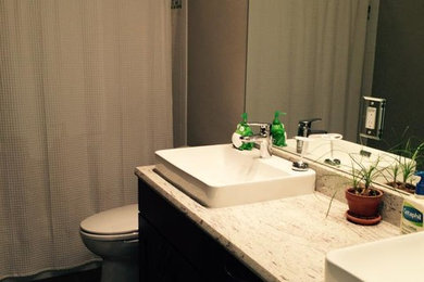 Inspiration for a mid-sized 3/4 bathroom remodel in Denver with a vessel sink, a one-piece toilet and beige walls
