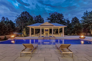 Pool - modern backyard stone and rectangular privacy pool idea in Baltimore