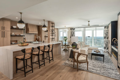 Mid-sized minimalist medium tone wood floor and beige floor kitchen photo in Other with an undermount sink, light wood cabinets, beige backsplash, porcelain backsplash, paneled appliances, an island, white countertops, beaded inset cabinets and marble countertops
