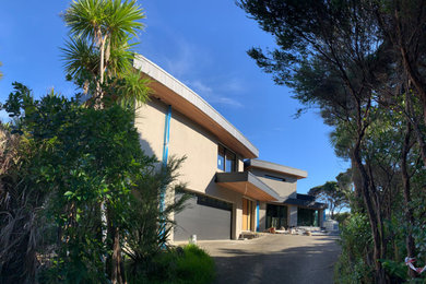 Contemporary two-storey house exterior in Auckland.