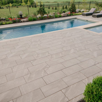 Contemporary Outdoor Pool and Covered Patio Using Porcea Creek Porcelain Pavers