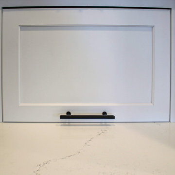 White Transitional Kitchen with Black Hardware and Glass Tile Backsplash