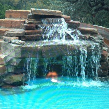 Outside Pool with Slide and Waterfall Design Features in NY and NJ