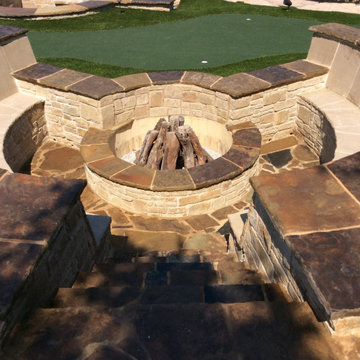 Overhead view of resort style pool, flagstone decking and artificial turf