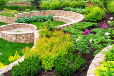 Design ideas for a classic courtyard formal garden in Minneapolis with a retaining wall.