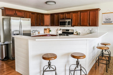 Inspiration for a mid-sized farmhouse u-shaped kitchen remodel in Other