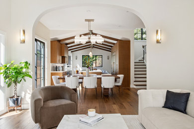 Mid-sized tuscan galley medium tone wood floor, beige floor and exposed beam open concept kitchen photo in San Francisco with an undermount sink, shaker cabinets, medium tone wood cabinets, quartzite countertops, multicolored backsplash, mosaic tile backsplash, black appliances, an island and white countertops