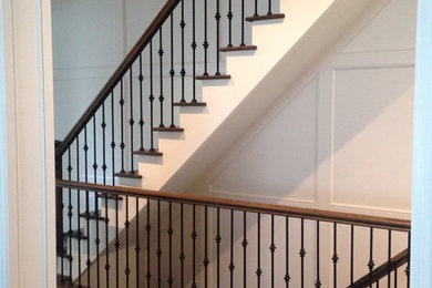 Example of a large classic wooden straight staircase design in Toronto with metal risers
