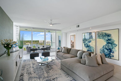 Inspiration for a large contemporary open concept porcelain tile, gray floor and wallpaper living room remodel in Miami with blue walls