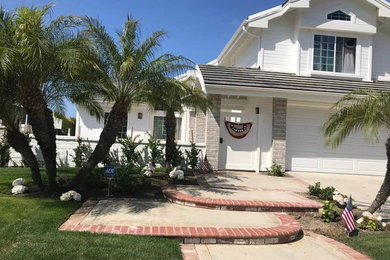 Inspiration for a transitional exterior home remodel in Orange County