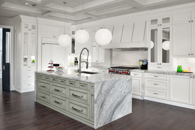 Large traditional u-shaped kitchen pantry in Toronto with recessed-panel cabinets, white cabinets, marble benchtops, white splashback, stone tile splashback, stainless steel appliances, dark hardwood floors and with island.