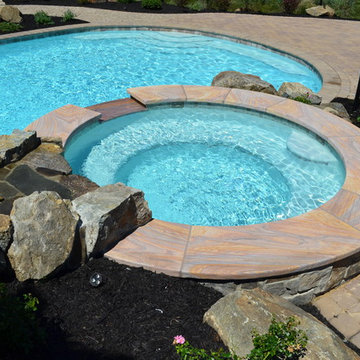 Custom Pools & Spas, Outdoor Kitchens, Patios & Walkways, and Plantings