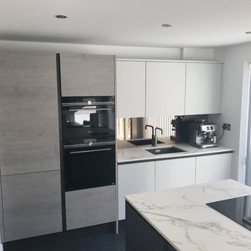 Contemporary grey scale handleless kitchen