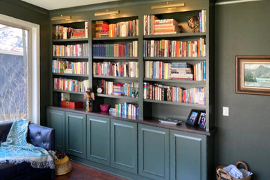 Example of a large transitional study room design in Other with green walls