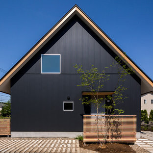 他の地域のアジアンスタイルのおしゃれな家の外観 (黒い外壁、切妻屋根、戸建) の写真