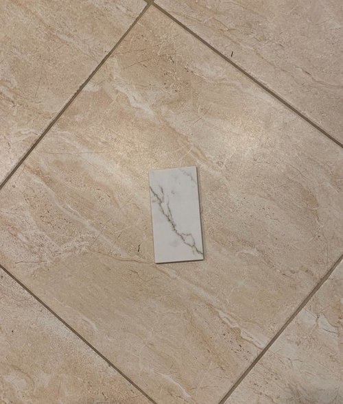 Marble Look Quartz Counters In A, Repair Travertine Floor Tile In A Kitchen
