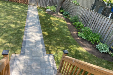 Simple Backyard Makeover - interlock walkway and sod