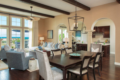 Large mediterranean open plan dining in Orange County with beige walls, dark hardwood floors and no fireplace.