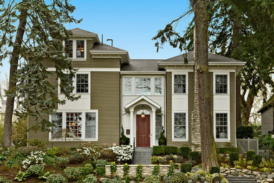 Huge craftsman green three-story wood exterior home idea in Seattle