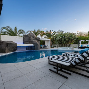 Contemporary Outdoor Escape in Scottsdale Spa, Outdoor Bar & Luxury Waterfall