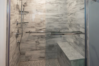 Bathroom - mid-sized transitional master ceramic tile ceramic tile, gray floor and single-sink bathroom idea in Philadelphia with shaker cabinets, white cabinets, a two-piece toilet, blue walls, an undermount sink, marble countertops, white countertops and a freestanding vanity