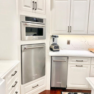 Ivory White Kitchen With Marble Look Quartz Counters and Splash