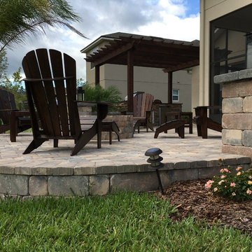 Backyard patio, firepit, pergola and summer kitchen