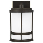 Sea Gull Lighting - Sea Gull Wilburn Small 1-LT Outdoor Wall, Bronze/White/Satin - With a nod to retro-industrial chic, the Wilburn outdoor fixtures wraps a white frosted glass shade in a fun metal cage to create a casual and easygoing look. Offered in Antique Bronze and Black finishes with Etched White glass, the assortment includes a one-light outdoor pendant, small medium, large, and extra-large one-light outdoor wall lanterns, a one-light out door post lantern and a one-light outdoor ceiling flush mount. Both incandescent lamping and ENERGY STAR-qualified LED lamping are available for most of the fixtures, and some can easily convert to LED by purchasing LED replacement lamps sold separately.