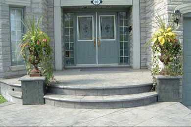 Example of a mid-sized classic gray concrete exterior home design in Portland