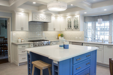 Large transitional u-shaped porcelain tile and gray floor enclosed kitchen photo with a double-bowl sink, recessed-panel cabinets, white cabinets, quartz countertops, green backsplash, ceramic backsplash, stainless steel appliances and an island