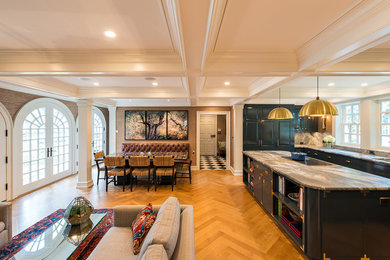 Example of a large classic u-shaped light wood floor eat-in kitchen design in Minneapolis with raised-panel cabinets, blue cabinets, marble countertops, white backsplash, marble backsplash, paneled appliances, an island and a single-bowl sink