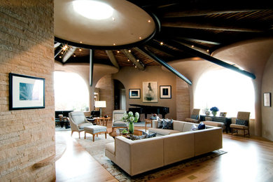 Inspiration for a huge southwestern open concept bamboo floor living room remodel in Albuquerque with a music area and beige walls