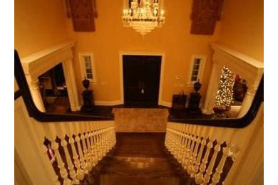 Example of a large classic dark wood floor double front door design in Indianapolis with a dark wood front door