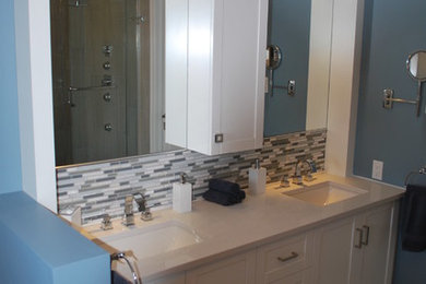 Example of a mid-sized transitional master blue tile, green tile, multicolored tile and matchstick tile porcelain tile bathroom design in Ottawa with shaker cabinets, white cabinets, blue walls, an undermount sink and quartz countertops