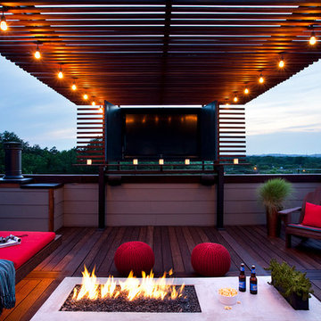 rooftop outdoor living with a TV and fire