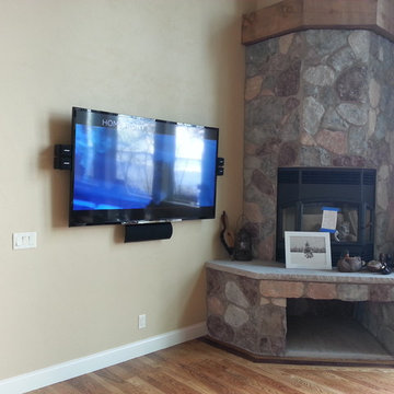 TV Wall Mounted Near corner Fireplace