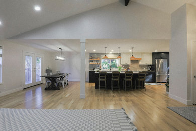 Example of a light wood floor living room design in Portland