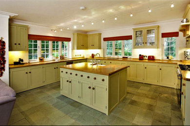 This is an example of a large classic kitchen in Sussex.