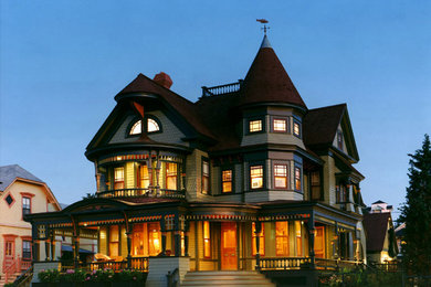 Inspiration for a large traditional three-storey beige exterior in Boston with wood siding.