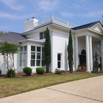 Grand Home with White Painted Brick Exterior