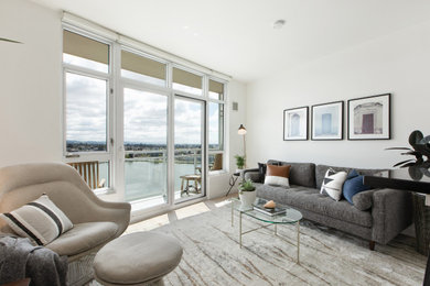 Example of a minimalist open concept light wood floor living room design in San Francisco with white walls
