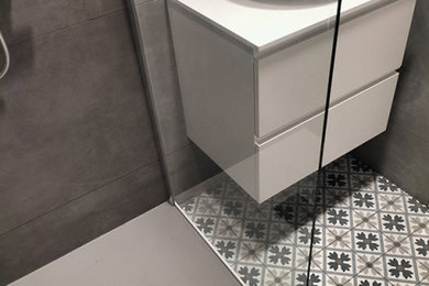 Design ideas for a small mediterranean grey and white shower room bathroom in Other with white cabinets, a built-in shower, grey tiles, ceramic tiles, blue walls, cement flooring, a vessel sink, engineered stone worktops, grey floors, white worktops, a single sink and a floating vanity unit.
