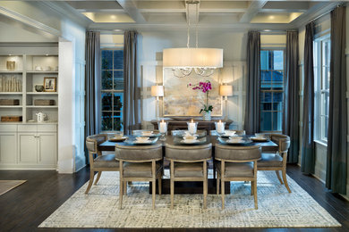 Medium tone wood floor great room photo in Charlotte with gray walls and no fireplace